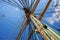 Steel masts of a sailing ship with the lowered sails.