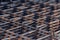 Steel mesh for construction Steel Rebars for reinforced concrete. Steel reinforcement bar texture in construction site