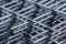 Steel mesh for construction Steel Rebars for reinforced concrete. Steel reinforcement bar texture in construction site