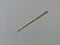 Steel needle for mechanical sewing machine, has silver and gold color