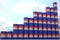 Steel oil drums with flag of Cambodia form increasing chart or upwards trend. Petrochemical industry growth concept, 3D