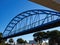 Steel pedestrian bridge over a busy street