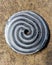 Steel plate with nice circularspiral pattern formed as a result of CNC machining