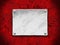 Steel plate on a red grunge background