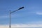 Steel pole, large lighting fixtures for stadiums or outdoor areas, parks, sky backgrounds.