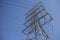 Steel pylon for high voltage power lines against blue sky