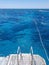 Steel railing ladder of yacht. Snorkeling in ocean, people float in sea of reef