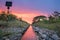 Steel railroad and signpost at twilight sky