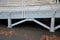 Steel ramp for the entry of supply trucks into an industrial hall or supermarket. solid galvanized construction with railings for