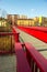 Steel red bridge over railway and block of flats