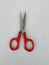 Steel and Red Color Small Single Scissor  on white Background