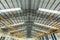 Steel roof truss in car repair center, Steel roof frame Under construction, The interior of a big industrial building or factory