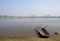 Steel sanitation boat at lakeside in sunny winter afternoon