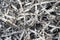 Steel scrap materials recycling.Aluminum chip waste after machining metal parts on a cnc lathe.Closeup twisted spiral steel