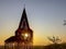 Steel see-through church in Borgloon Hesbaye, Belgium, known as the art project Reading between the lines, during sunset