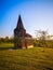 Steel see-through church in Borgloon Hesbaye, Belgium, known as the art project Reading between the lines, during sunset