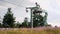 Steel ski chairlift station on the top of Carpathian mountain. Moving ski lift station on mountain top at sunny summer day