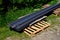 Steel strips used as a construction material for the creation of curbs forming park paths in the garden. folded on a pallet in a b