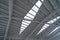 Steel structure of modern terminal station building roof. Metal windows glass facade frames supported. Abstract interior