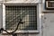 Steel window frame and the vent shade side on wall of an old house