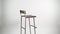 Steel with wooden chair on white background. Bar stool