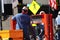 Steelworkers doing steel construction on a trailer.