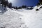 Steep angled slopes on mountain showing avalanche terrain