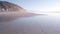 Steep cliff, rock or bluff, California coast. People walking, Torrey Pines beach