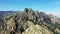 The steep cliffs of the Col de Bavella in the green countryside