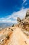 Steep dangerous mountain road with a big gravel in the mountains of Sardinia, Italy