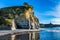 Steep and dangerous White rocks on the Pacific coast. Sunrise. Exotic journey to the end of the world. North Island, New Zealand