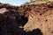 Steep gully in Joffre Gorge in Karijini National Park in Western Australia at afternoon with a creek