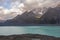 Steep high cliffs above the lake. Lake Tasman. New Zealand