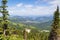 Steep mountain and lake views from the summit of Mt Spokane State Park overlooking the Spokane Washington area on a summer day