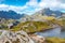 Steep mountains of Lofoten Island on a sunny arctic day. Hermannsdalstinden peak from the trail from Moskenes. Hiking mountains of