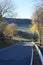 steep narrow country road during autumn