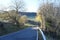 steep narrow country road to Jammelshofen during autumn