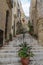 Steep narrow street with steps in Birgu aka Vittoriosa, Malta.