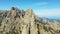 The steep and rocky cliffs of the Col de Bavella in the green countryside