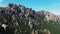 The steep and rocky mountains of the Col de Bavella in the green countryside