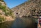 Steep rocky sides of canyon on banks of the Douro river entering narrow gorge