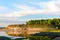 The steep slope of the shore with different soil clay and sand from the Northern rivers of Yakutia