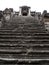 Steep stone staircase of the third level of Angkor Wat before a railing was installed.