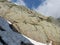 Steep stone wall and snow field with via ferrata, protected climbing route, marked path of Stubai hiking trail, Stubai