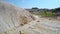 Steep stony slope on old clay pit and canyon bed