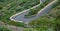 Steep u-shape curved mountain road in the middle of the bush