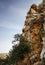 Steep weathered cliff face over dramatic sky