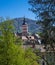 The steeple of the collegiate church in Baden Baden in the background the Merkur mountain. Baden Wuerttemberg, Germany, Europe