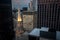 Steeple illuminated in Chicago skyline at dusk