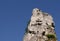 Steeple rock with cross Climbers trying reach peak